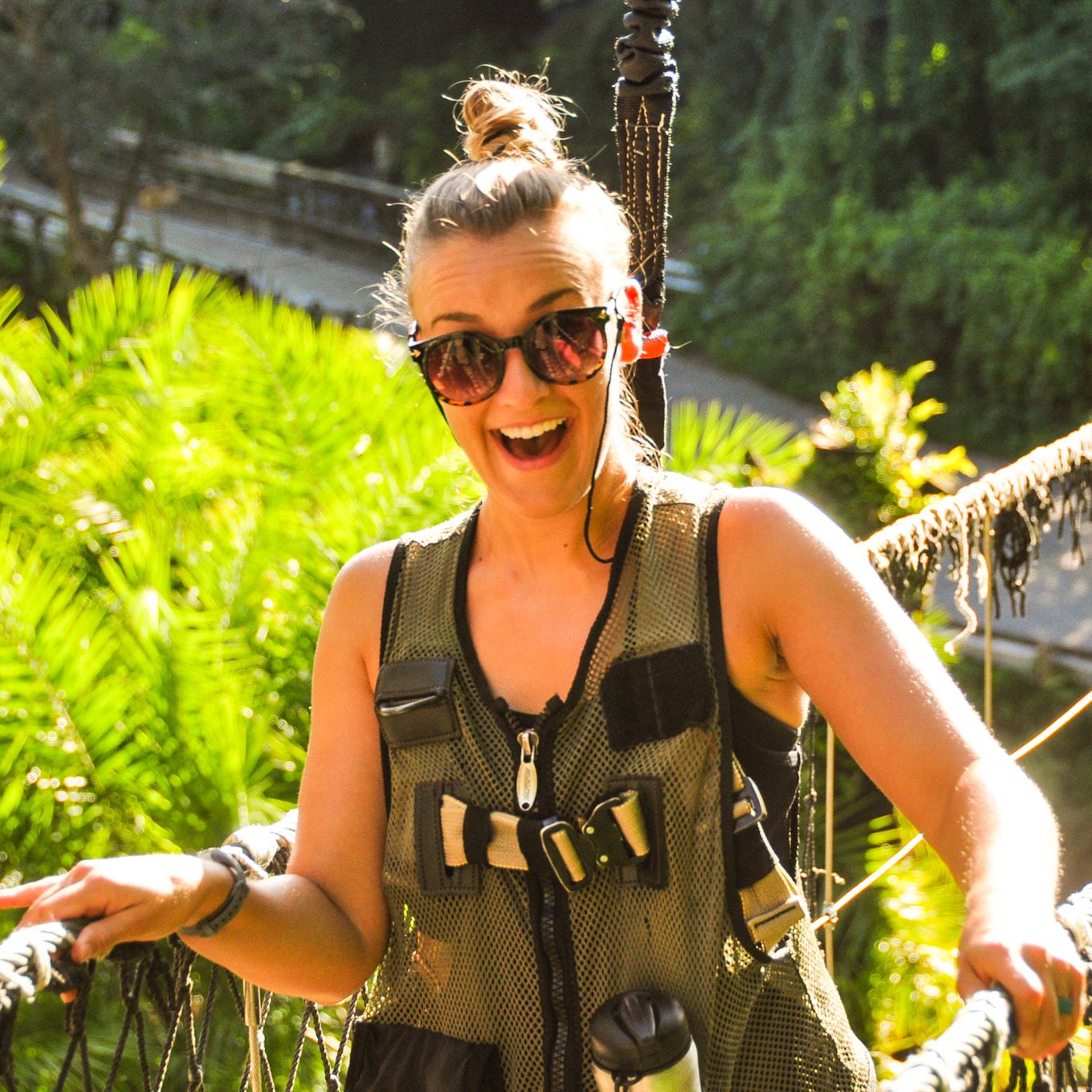 Marissa with a big smile, harnessed while on an outdoor excursion